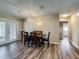 Dining area featuring hardwood floors and access to the backyard through french doors at 898 Hendry Dr, Orlando, FL 32822