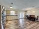 Open kitchen and dining area with stainless steel appliances and granite countertops at 898 Hendry Dr, Orlando, FL 32822