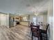 Open-concept kitchen and dining room with modern appliances and stylish countertops at 898 Hendry Dr, Orlando, FL 32822