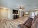 Inviting living room features hardwood floors, modern ceiling fan, entertainment center, and a welcoming ambiance at 898 Hendry Dr, Orlando, FL 32822