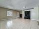 Large living room with tile flooring, great natural light, and neutral walls at 898 Hendry Dr, Orlando, FL 32822