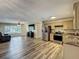 Bright living space includes open kitchen and living room with modern appliances and wood floors at 898 Hendry Dr, Orlando, FL 32822