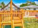 Wooden playground playset on the back lawn for with swings and fort with play steering wheel at 898 Hendry Dr, Orlando, FL 32822