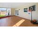 Enclosed sunroom featuring tile flooring and views of the fenced backyard at 898 Hendry Dr, Orlando, FL 32822