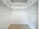 Walk-in closet with white walls and white shelf and bar system at 898 Hendry Dr, Orlando, FL 32822