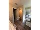 Hallway view of the bathroom with wood look tile flooring at 9028 Se 41St Court Rd, Ocala, FL 34480