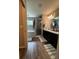 Modern bathroom featuring dual vanities, tiled shower, and separate soaking tub for a spa-like experience at 9028 Se 41St Court Rd, Ocala, FL 34480