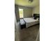 Bedroom with neutral tones and large window at 9028 Se 41St Court Rd, Ocala, FL 34480