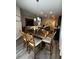 Inviting dining area featuring a chandelier and comfortable seating adjacent to the kitchen at 9028 Se 41St Court Rd, Ocala, FL 34480