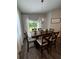 Cozy dining area with stylish table set and natural light, adjacent to outdoor patio, perfect for Gathering meals at 9028 Se 41St Court Rd, Ocala, FL 34480