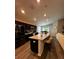 Spacious kitchen with a large island, seating, sleek cabinetry, and modern stainless steel appliances at 9028 Se 41St Court Rd, Ocala, FL 34480