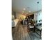 Open-concept kitchen with center island, stainless steel appliances, and adjacent dining area at 9028 Se 41St Court Rd, Ocala, FL 34480