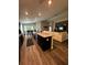Open-concept design showcasing a seamless flow between the kitchen, dining area, and cozy living room at 9028 Se 41St Court Rd, Ocala, FL 34480
