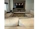 Cozy living room with a modern entertainment center and comfortable sectional sofa at 9028 Se 41St Court Rd, Ocala, FL 34480