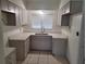 Updated kitchen featuring sleek countertops, ample cabinet space, and modern stainless steel fixtures at 936 Pinedale Ave, Orlando, FL 32808