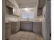 A renovated kitchen featuring modern cabinetry, updated countertops, and a stainless steel faucet at 936 Pinedale Ave, Orlando, FL 32808