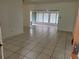 Spacious living room with tiled floors, offering ample natural light and room to entertain at 936 Pinedale Ave, Orlando, FL 32808