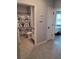 This bathroom has a toilet, vanity with sink, and a shower with an elephant-patterned shower curtain at 6768 Coral Berry Dr, Mount Dora, FL 32757