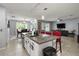 Spacious open-concept kitchen island overlooking the dining area and living room at 6768 Coral Berry Dr, Mount Dora, FL 32757