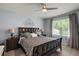 Main bedroom boasts a large window for natural light and a decorative lotus flower wall decal at 6768 Coral Berry Dr, Mount Dora, FL 32757