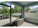 This is a screened-in lanai with outdoor seating looking out to a fenced-in backyard at 6768 Coral Berry Dr, Mount Dora, FL 32757