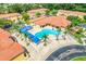Aerial view showcasing the community pool with cabanas, lounge chairs, and lush landscaping at 1000 Park Club Dr, Kissimmee, FL 34746