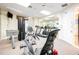 Bright community gym featuring modern exercise equipment, mirrors, and ceiling fans at 1000 Park Club Dr, Kissimmee, FL 34746