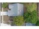 Aerial view of roof, driveway, nearby swimming pool, and mature trees at 1003 Chesterfield Cir, Winter Springs, FL 32708