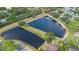 Aerial view showcases the community ponds and surrounding landscaping at 1003 Chesterfield Cir, Winter Springs, FL 32708