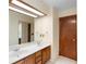 Bathroom features a dual sink vanity and an oversized mirror at 1003 Chesterfield Cir, Winter Springs, FL 32708