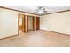 Bedroom with neutral carpet, ceiling fan, and access to ensuite bathroom at 1003 Chesterfield Cir, Winter Springs, FL 32708