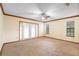 Bedroom with neutral carpet, ceiling fan, and natural light at 1003 Chesterfield Cir, Winter Springs, FL 32708