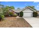 Charming single-story home with brick accents, well-maintained landscaping, and a spacious driveway at 1003 Chesterfield Cir, Winter Springs, FL 32708