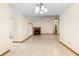 Bright living room featuring a cozy fireplace, tile floors, and access to the outdoors at 1003 Chesterfield Cir, Winter Springs, FL 32708
