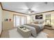 Bright main bedroom with french doors, and a calm color palette, creating a relaxing retreat at 1003 Chesterfield Cir, Winter Springs, FL 32708