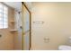 Modern shower featuring tiled walls, glass door, and shelving at 1003 Chesterfield Cir, Winter Springs, FL 32708