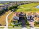Gorgeous aerial view of estate home on golf course lot with lush landscaping at 10196 Bucklow Hill Dr, Orlando, FL 32832