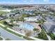 Aerial view of community with pools, green spaces, parking, clubhouse and more at 10196 Bucklow Hill Dr, Orlando, FL 32832