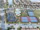 Aerial view of community amenities including pool, tennis courts, clubhouse, and parking at 10196 Bucklow Hill Dr, Orlando, FL 32832