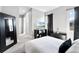 Primary bedroom features carpet, a TV, dark accent wall and a large mirror at 10196 Bucklow Hill Dr, Orlando, FL 32832