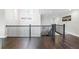 View of the Foyer and stairs with decorative chandelier and dark hardwood floors at 10196 Bucklow Hill Dr, Orlando, FL 32832