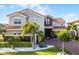 Charming two-story home featuring mature landscaping and a paved circular driveway at 10196 Bucklow Hill Dr, Orlando, FL 32832