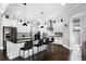Gourmet kitchen with island seating, stainless appliances, and white cabinetry at 10196 Bucklow Hill Dr, Orlando, FL 32832