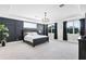 Spacious bedroom featuring a modern design, large windows, and tray ceilings at 10196 Bucklow Hill Dr, Orlando, FL 32832