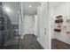 Mud room features built-in shelving and easy access to wine cellar and pantry at 10196 Bucklow Hill Dr, Orlando, FL 32832