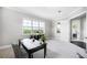 Inviting home office with large windows and scenic views at 10196 Bucklow Hill Dr, Orlando, FL 32832
