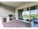 The covered patio with brick floors and a built-in outdoor kitchen provides the perfect space to entertain at 10196 Bucklow Hill Dr, Orlando, FL 32832