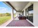 Covered patio with an outdoor kitchen, brick floors and comfortable seating at 10196 Bucklow Hill Dr, Orlando, FL 32832