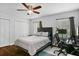Bedroom features a modern bed, work desk, and closet for ample storage and productivity at 1020 Grove St # 29, Maitland, FL 32751