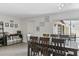 Spacious dining room with bar area, decorative art, and sliding doors to the outdoor patio at 1020 Grove St # 29, Maitland, FL 32751